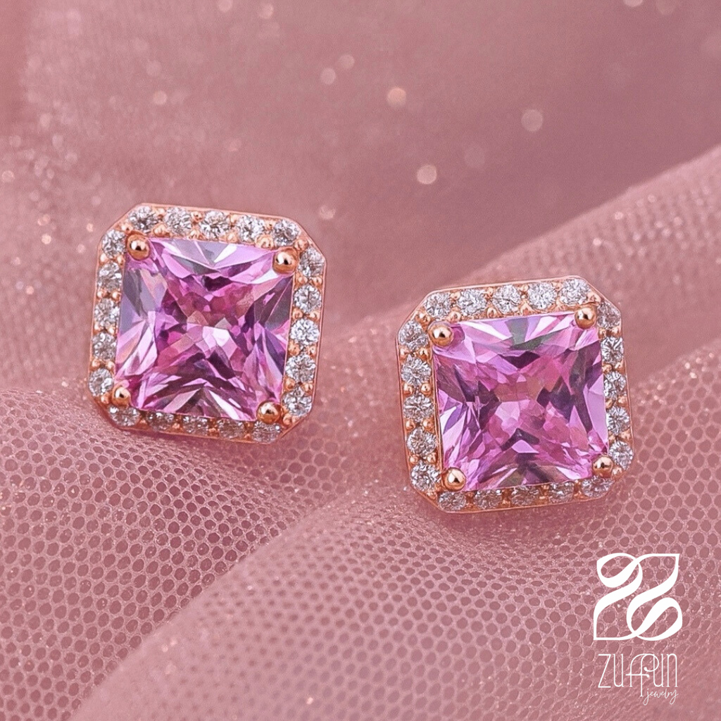 Pink gemstone earrings with rose gold setting on a pink background, Zuffun brand visible.