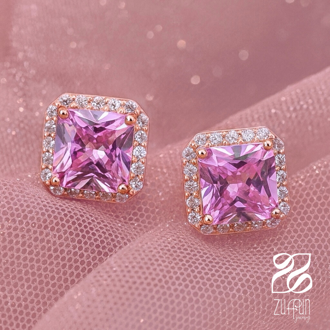Pink gemstone earrings with rose gold setting on a pink background, Zuffun brand visible.