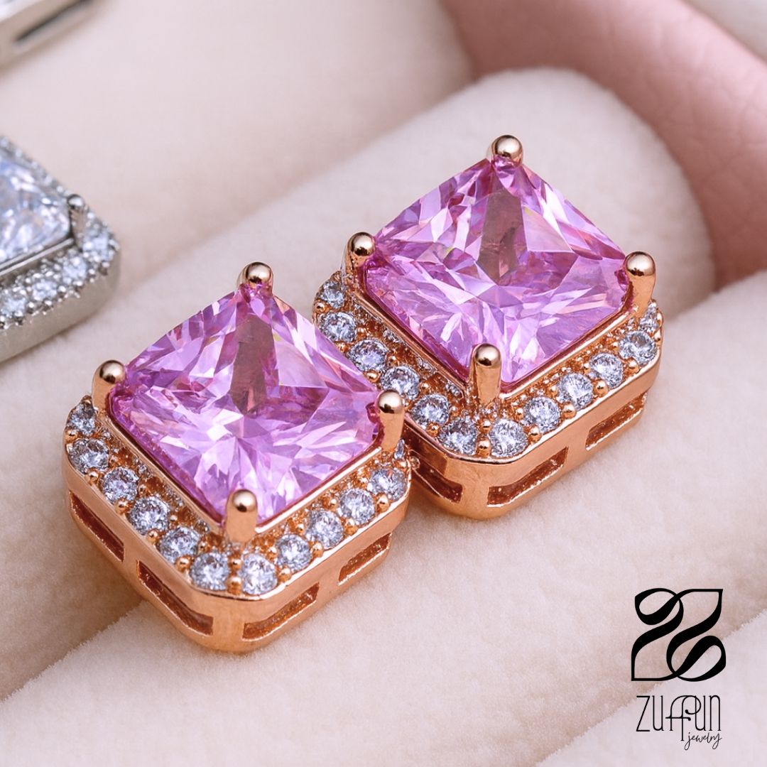 Pink gemstone earrings with rose gold accents on a soft background, featuring the Zuffun Jewelry logo.